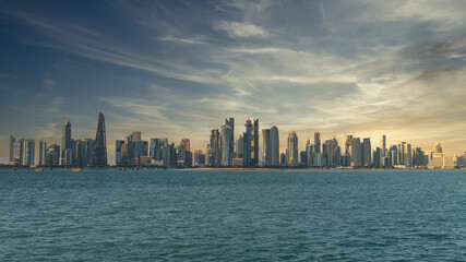 Doha, Qatar - February 2019: Doha Qatar skyline cityscape with skyscrapers under dramatic clouds