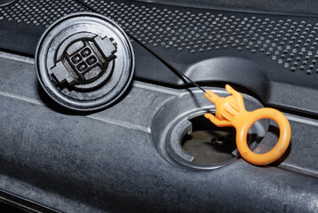 Engine oil filler and dipstick