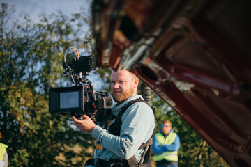 Director of photography with a camera in his hands on the set.