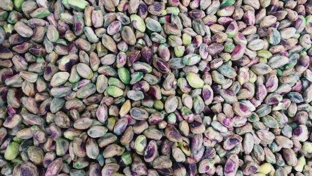 Colorful Peanut or Cheena Badam close up view .Smooth Movement of a pile of peanut kernels, without shells.