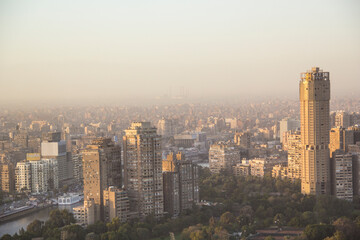 CAIRO, EGYPT - DECEMBER 29, 2021: Beautiful view of the center of Cairo and Zamalek island from the Cairo Tower in Cairo, Egypt - obrazy, fototapety, plakaty