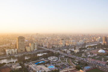 Naklejka na ściany i meble CAIRO, EGYPT - DECEMBER 29, 2021: Beautiful view of the center of Cairo and Zamalek island from the Cairo Tower in Cairo, Egypt