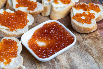 natural red salmon caviar with baguette and butter