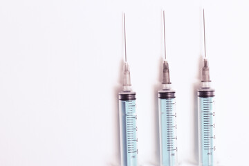 Medical syringe on a white background. A syringe for injection. The concept of health and beauty
