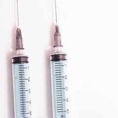 Medical syringe on a white background. A syringe for injection. The concept of health and beauty