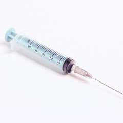 Medical syringe on a white background. A syringe for injection. The concept of health and beauty