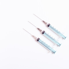 Medical syringe on a white background. A syringe for injection. The concept of health and beauty