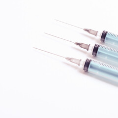 Medical syringe on a white background. A syringe for injection. The concept of health and beauty