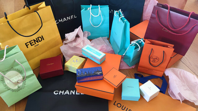 Colourful bags of luxurious jewellery after a shopping in Parisian department stores on the Boulevard Haussmann.