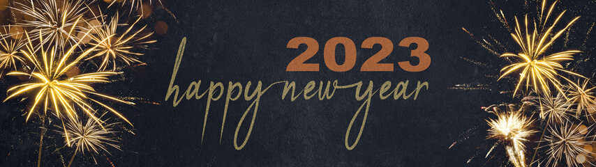 HAPPY NEW YEAR 2023 - Festive silvester New Year's Eve Party background panorama greeting card banner long - Golden fireworks in the dark black night