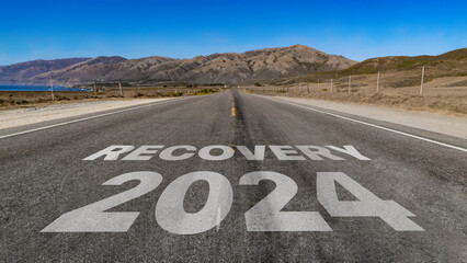 Recovery 2024 written on highway road to the mountain	
