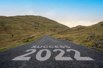 Success 2022 written on a mountain pass road in the Lake District.