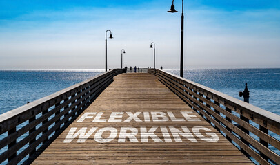 Flexible working written on the wooden planks of a pier on the Pacific Coast	
