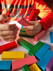 hand holding a block