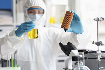Scientist in laboratory conducts research on automotive toxic filters