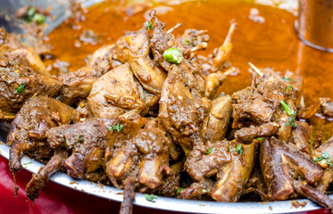 Delicious spicy chicken curry on a dish close up shot with selective focus