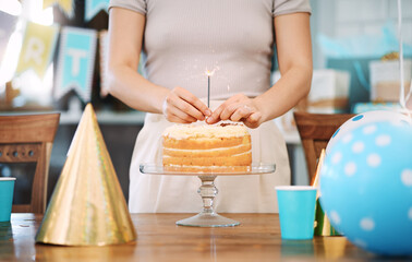 You should live everyday like its your birthday. Shot of an unrecognisable woman celebrating a birthday at home.