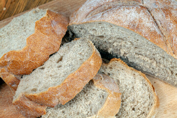 cut wheat bread on a wooden table