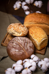 assortment of fresh crusty bread of different types