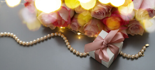 fresh rose flowers on gray