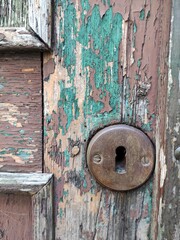 old doors, boards and a lock and a keyhole