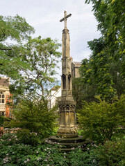 CAMBRIDGE, UK - AUGUST 11, 2017:  Monument Cross in All Saints Garden