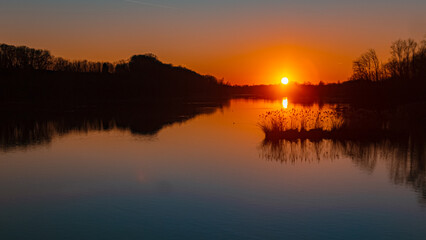 Beautiful sunset with reflections near Zeholfing, Isar, Bavaria, Germany