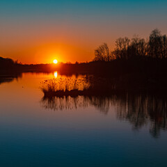 Beautiful sunset with reflections near Zeholfing, Isar, Bavaria, Germany