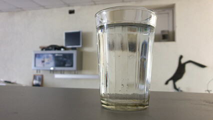 A glass of water on the table in the workshop