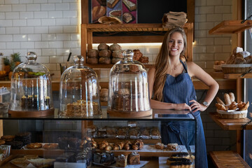 All our treats are baked to perfection. Portrait of a young business owner standing behind the...