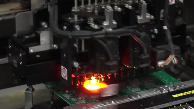 Electronic circuit board production. Automated Circut Board machine Produces Printed digital electronic board. Electronics contract manufacturing. Manufacture of electronic chips. High-tech. hd