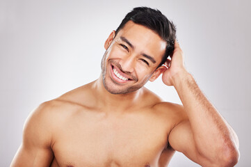Coffee smile, lilac skin. Cropped studio portrait of a handsome young man playfully posing against...
