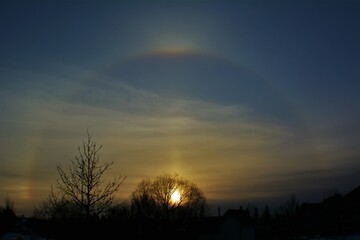 Sunset with halo on the horizon.