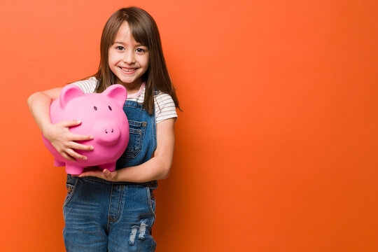 Happy girl loves to save money