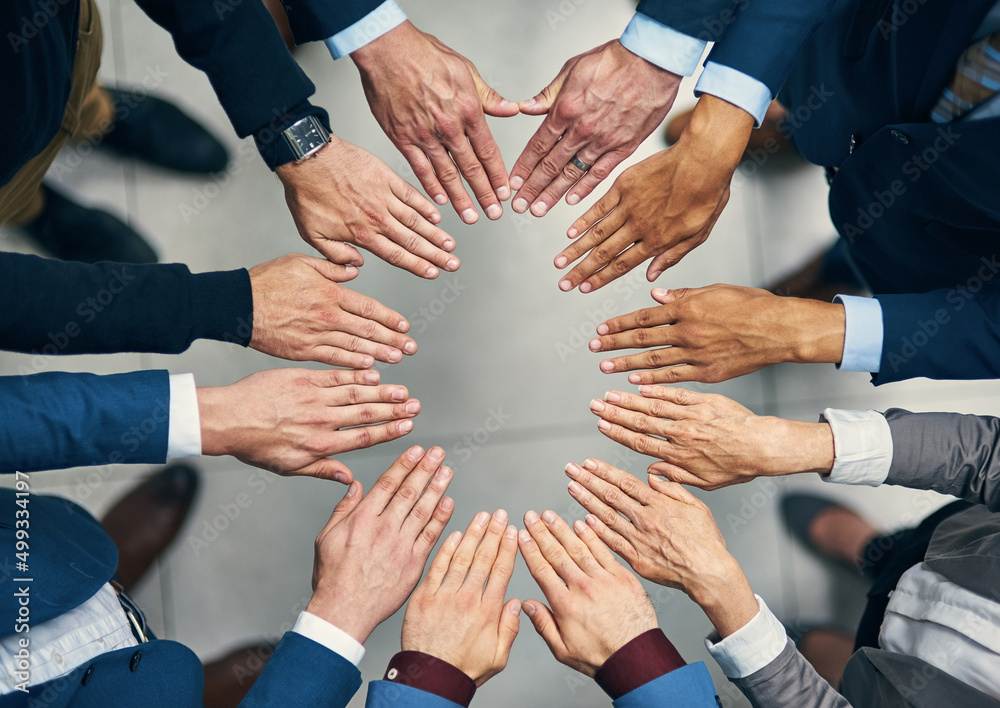 Poster you cant get to success without having solidarity. high angle shot of a group of businesspeople join