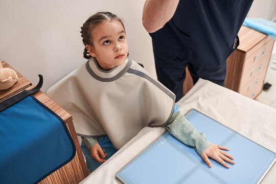 Female Child Putting Her Hand At The Special Place And Making X Ray During The Radiotherapy