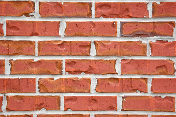 Close up of old imperfect historic brick wall on building in North Florida. 