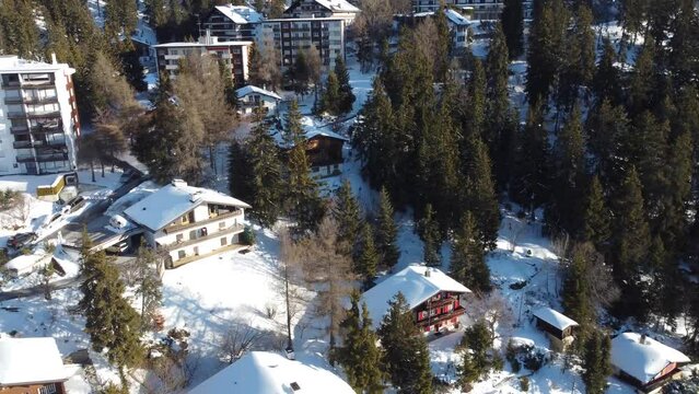 Crans Montana Ski resort, 4k drone video footage of crans montana ski resort flying through the valley of Crans Montana, Swiss Alps, Ski Resort in perfect light in the morning of fresh snow.