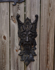 Oriental old door knocker on wood door