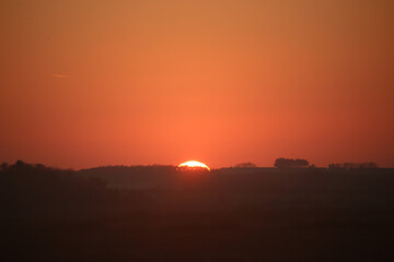 Sunset over the tidal marshes outside Blakeney in Norfolk, England during the autumn