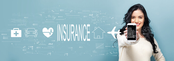 Insurance concept with young woman holding out a smartphone in her hand