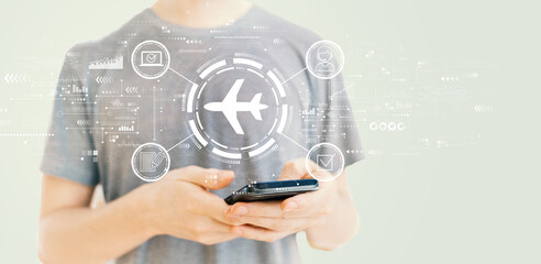 Flight ticket booking concept with young man using a smartphone