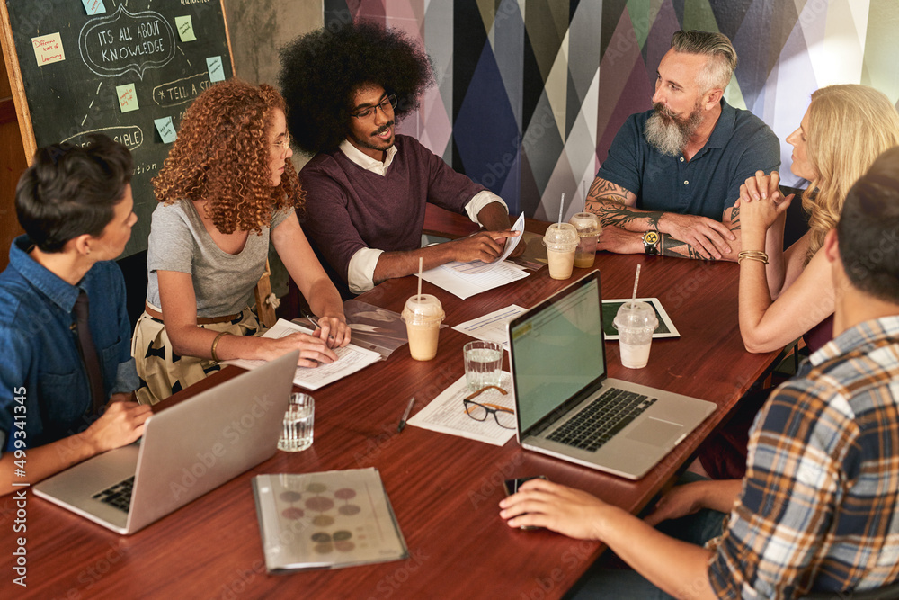 Poster create and collaborate is the way to success. cropped shot of creative colleagues having a meeting i