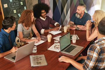 Create and collaborate is the way to success. Cropped shot of creative colleagues having a meeting in a modern office.