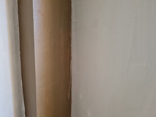 Abstract background photo depicting a wall with white paint combined with brown paint