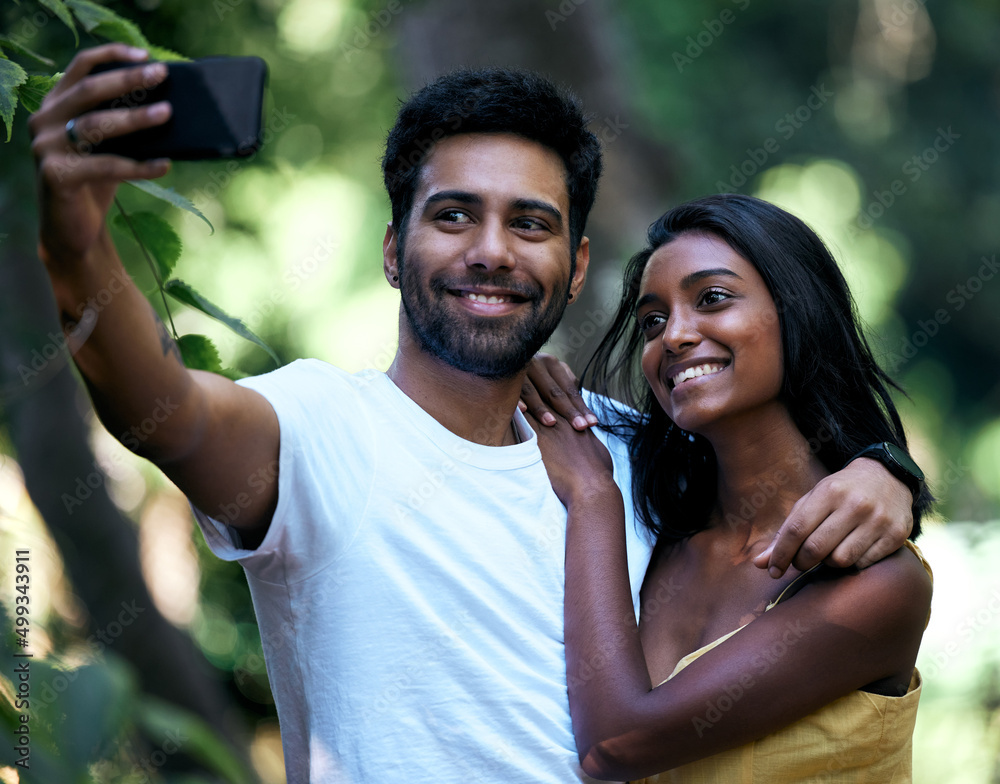 Sticker I cant picture my life without you in it. Shot of a young couple taking a selfie while out on a date.