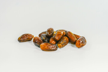 Dried dates isolated on white background.