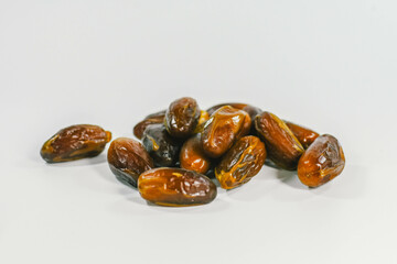 Dried dates isolated on white background.