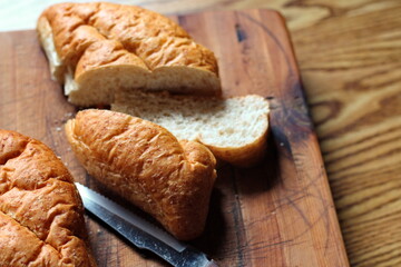Baked bread placed on a wooden table. Flat-lat photo.