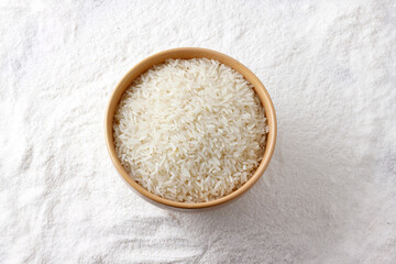 rice grains in bowl over organic rice flour